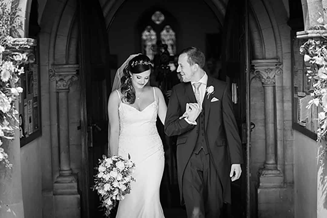Black and white documentary wedding photography — bride and groom walking, Simply Beautiful Photo & Film
